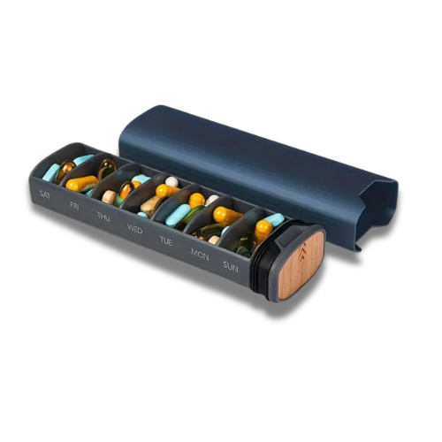 Pill Dispenser with sliding cover and seven compartments pre-filled with daily supplement capsules for easy travel use