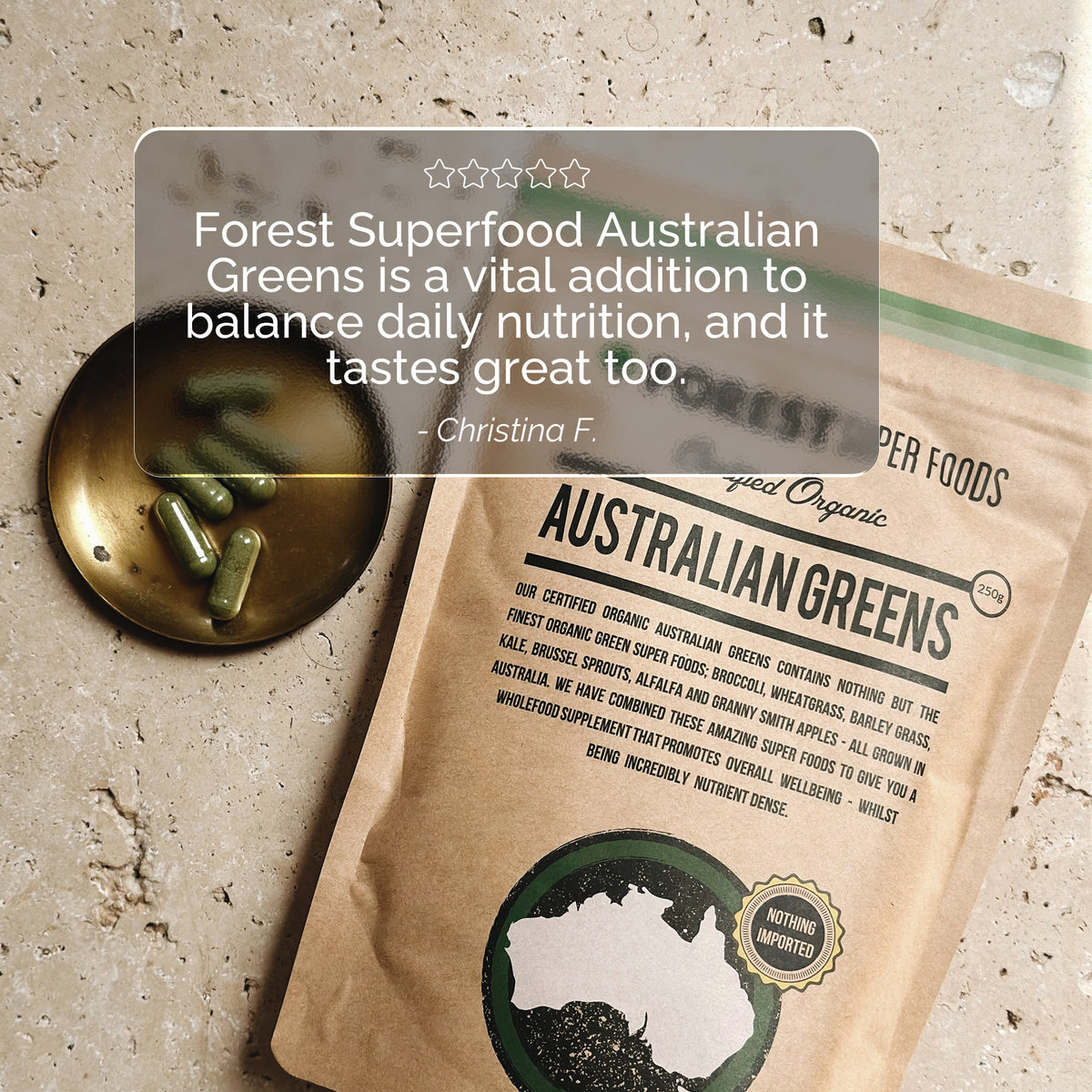 Australian Greens Whole Food Capsules pouch with organic Australian grown superfood blend beside green capsules on brass dish